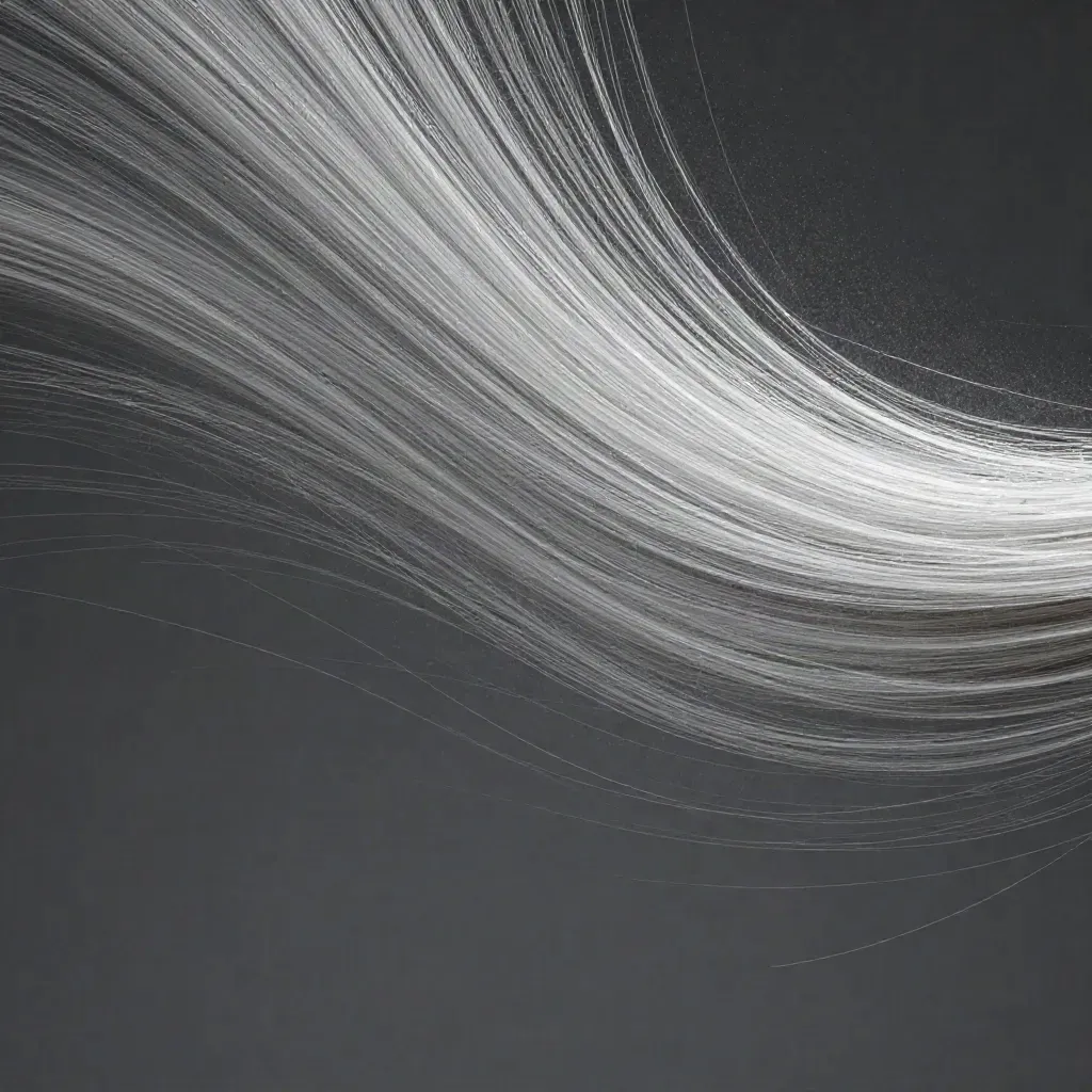 Abstract silver light filaments bloom in dark graphite space with drifting motes.
